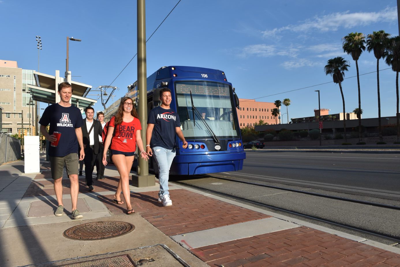 group waking by bus